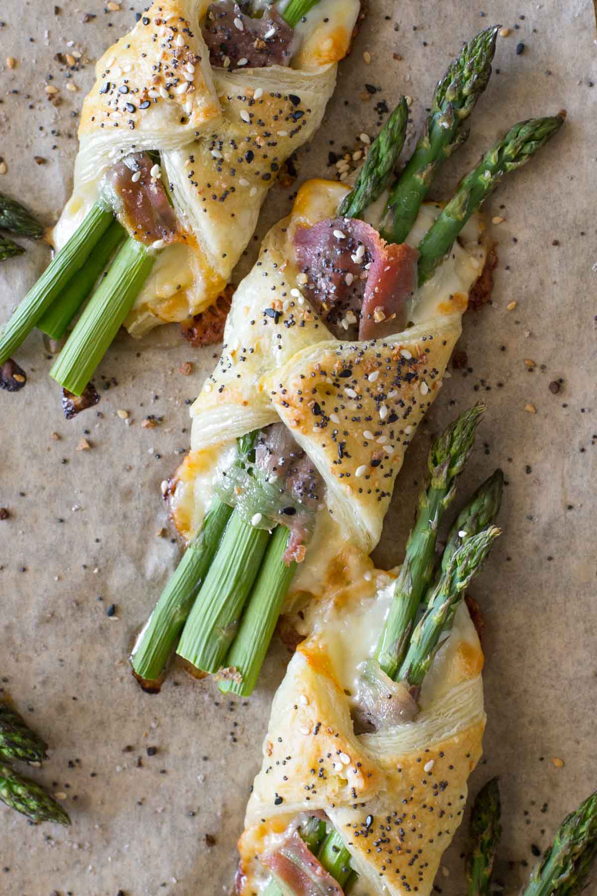Close up overhead Puff Pastry Asparagus bundles with cheese and prosciutto.  