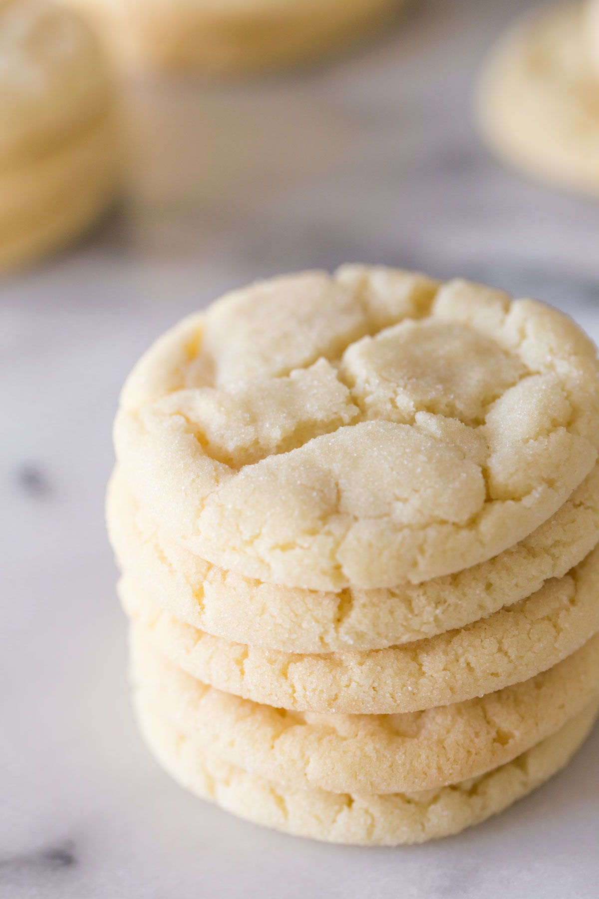 Close up view of a stack of Soft and Chewy Sugar Cookies. 