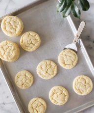 Overhead view of Soft and Chewy Sugar Cookies on a grey baking sheet.
