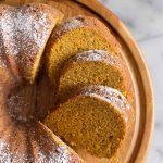 Overhead view of Apple Pumpkin Cake on a wooden cake stand.