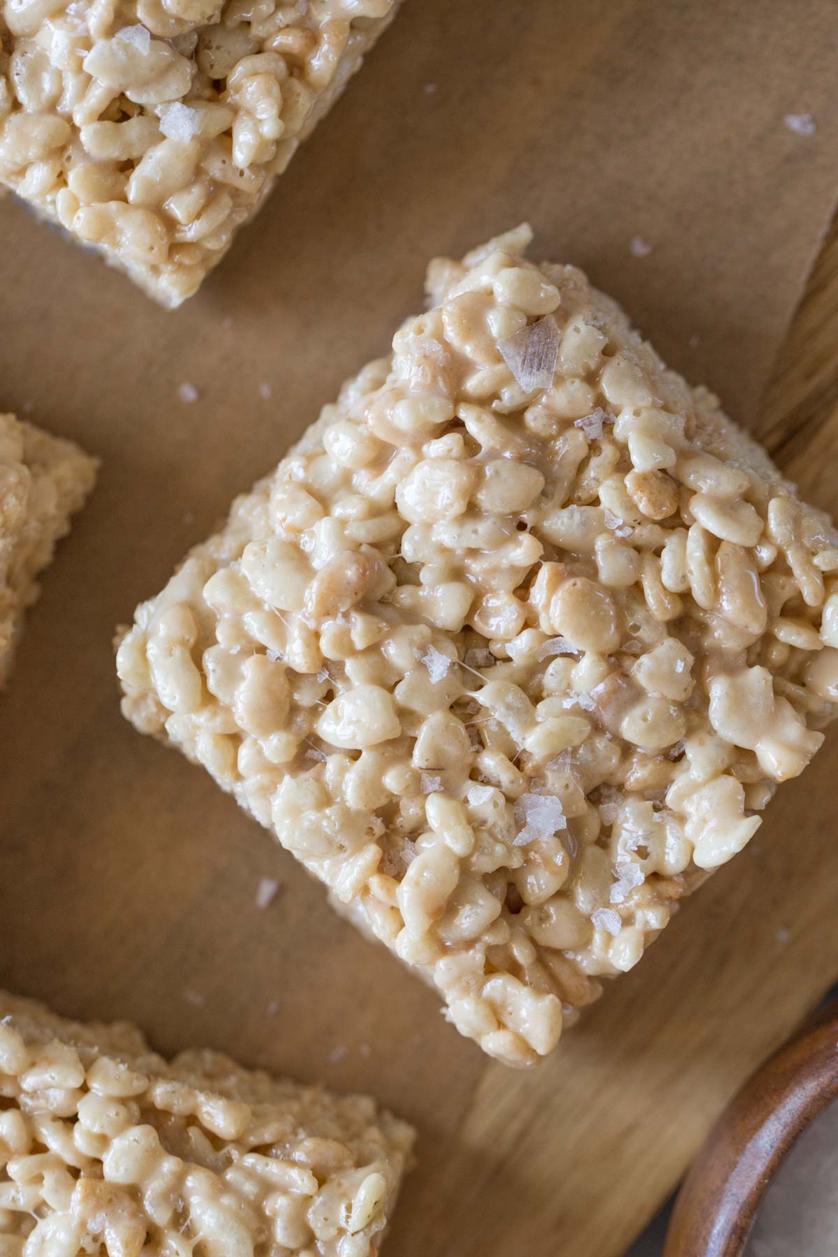 Close up overhead view of Salted Caramel Rice Krispie Treat with flakey sea salt on top. 