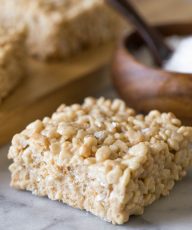 Close up view of Salted Caramel Rice Krispie Treat on a marble board.