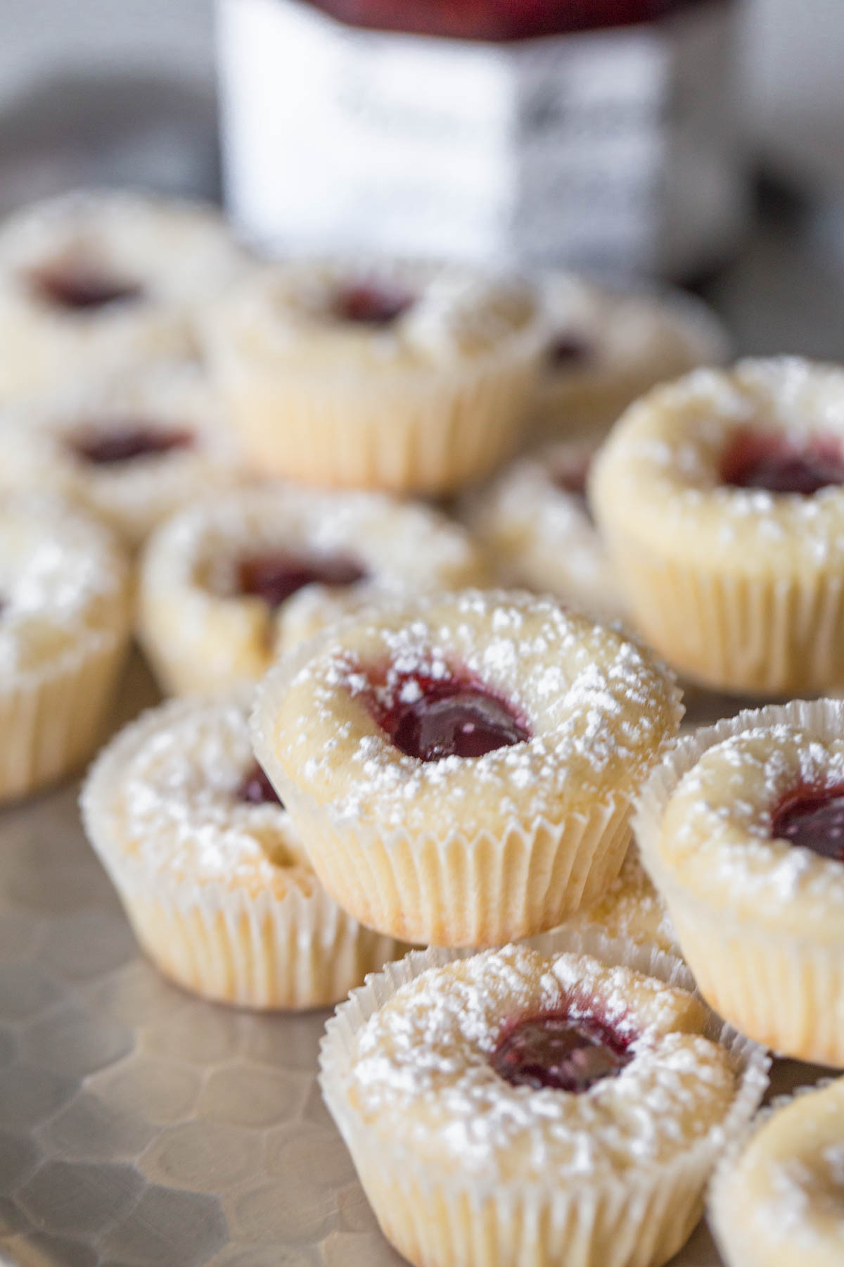 Close up view of Mini Raspberry Almond Tarts stacked.