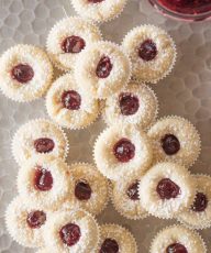 Overhead view of Mini Raspberry Almond Tarts on a sliver tray.