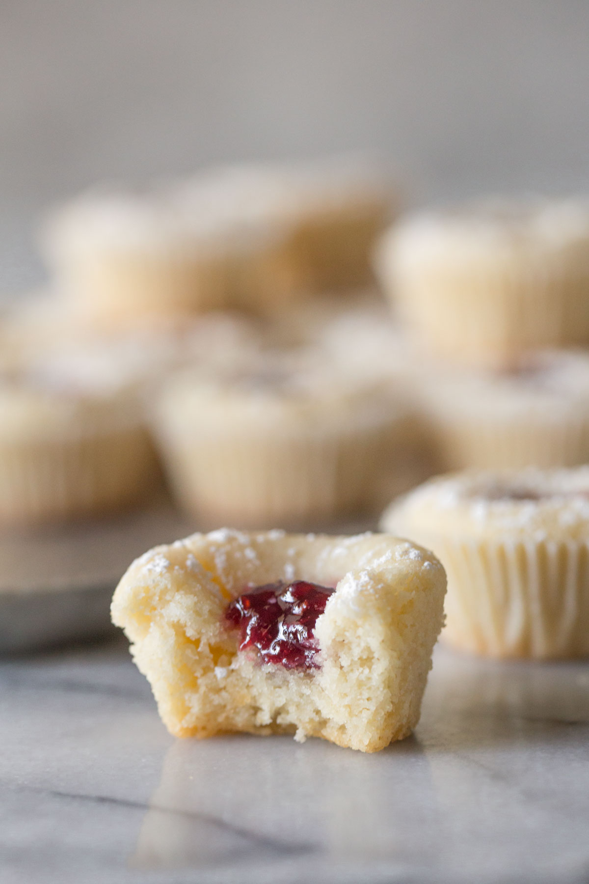 Close up view of Mini Raspberry Almond Tart showing the inside. 