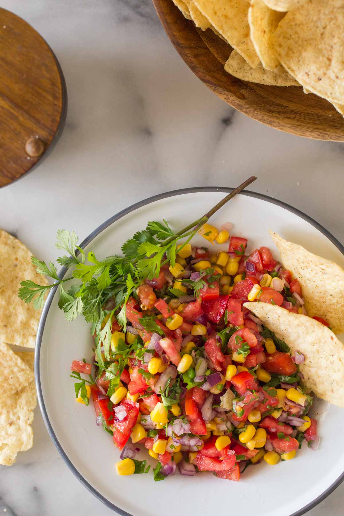 Overhead view of Homemade Pico de Gallo in a white bowl. 