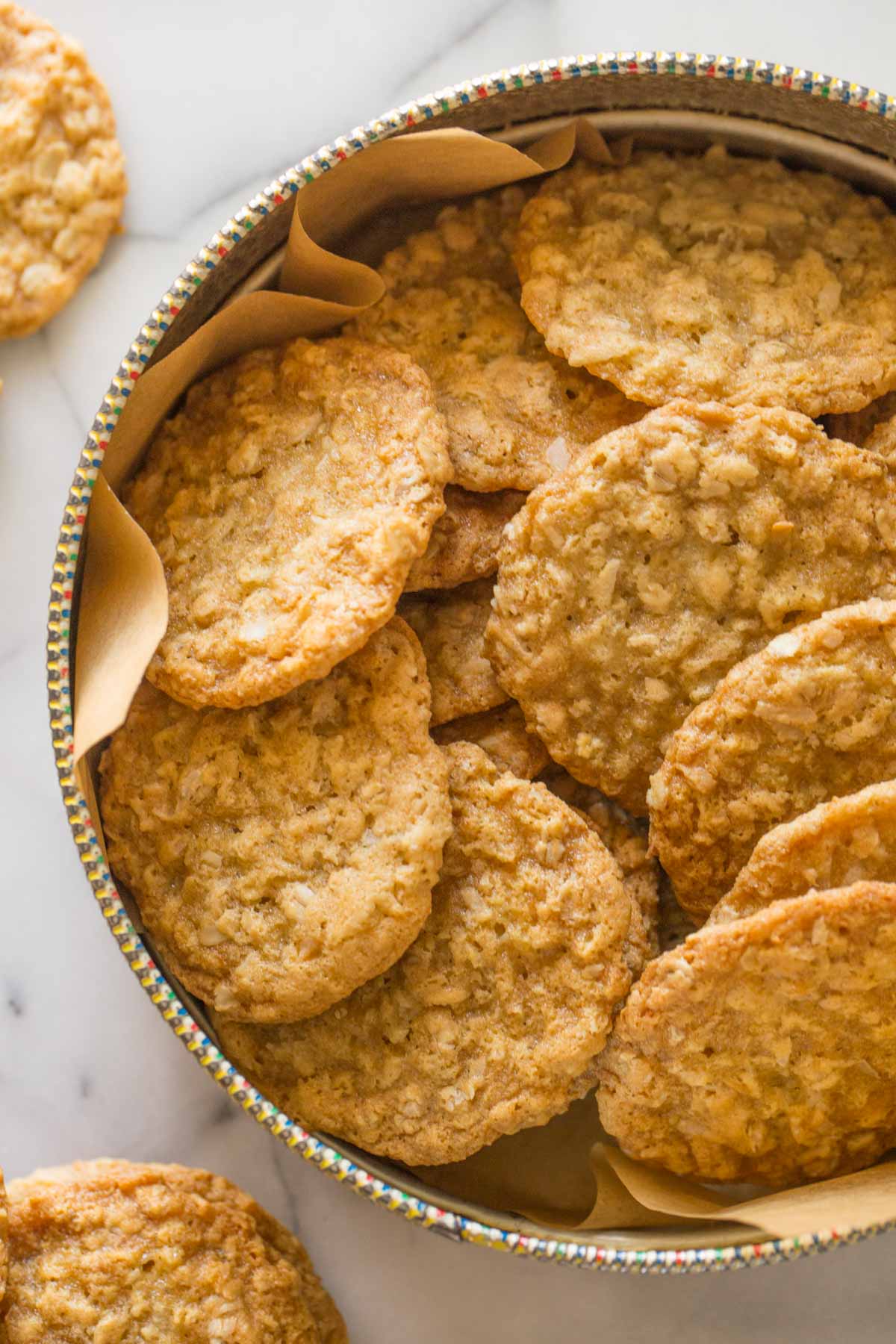 Close up overhead shot of Buttery Coconut Oatmeal Cookies in a container.  