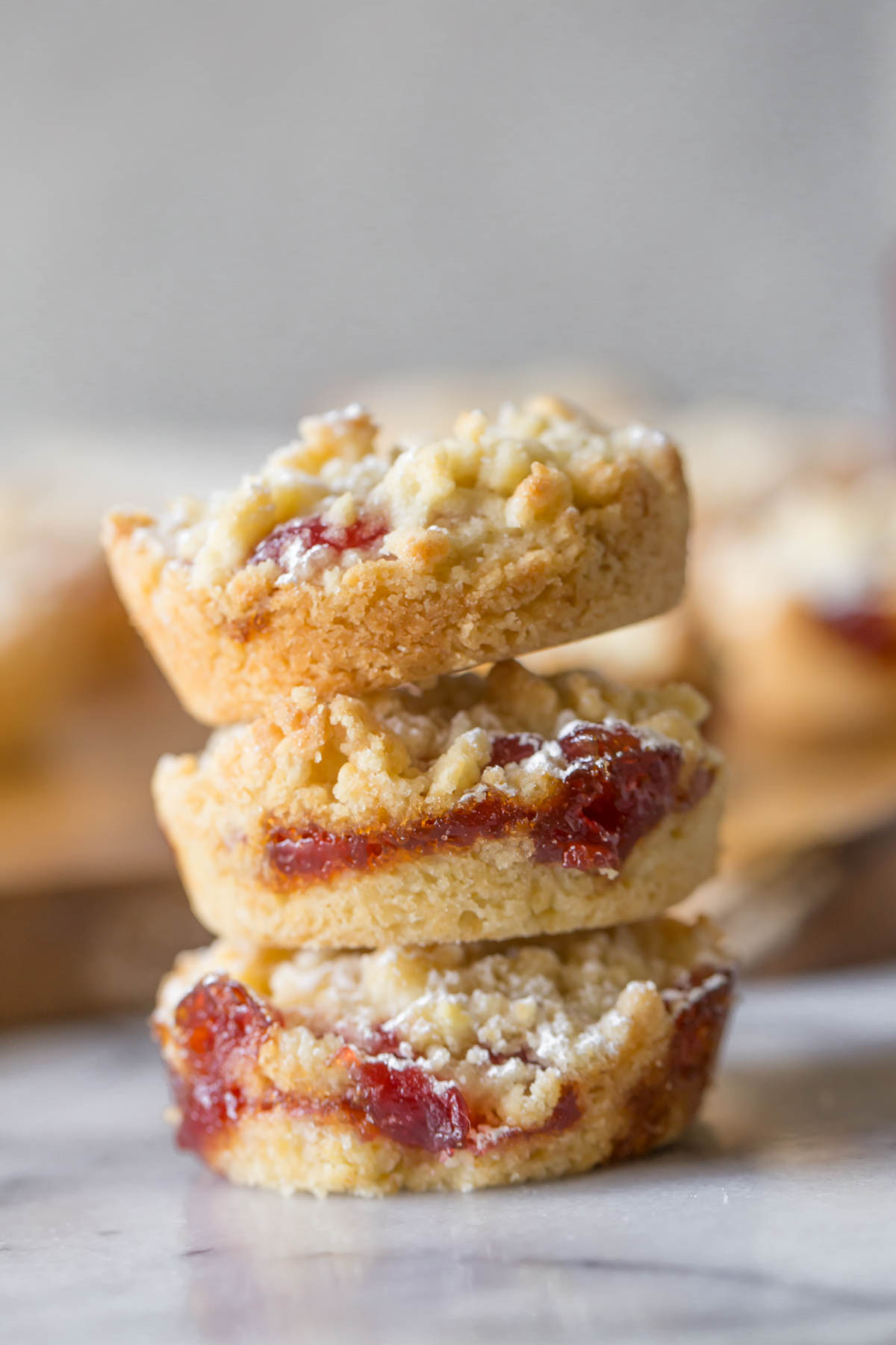 Close up shot of Costco Raspberry Crumble Cookies stacked three high.  